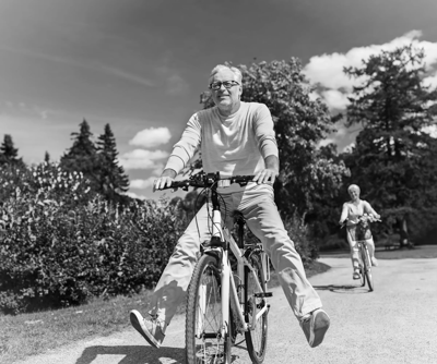 Seniors biking together in a park