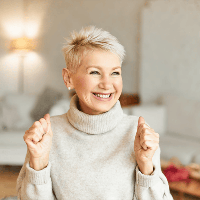 Smiling elderly woman in a cozy setting