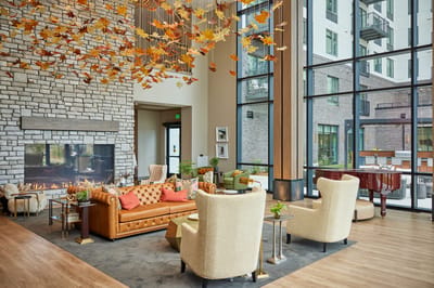 Modern lobby with stylish seating and autumn decor