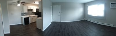 Panoramic view of a facility interior kitchen and living area.