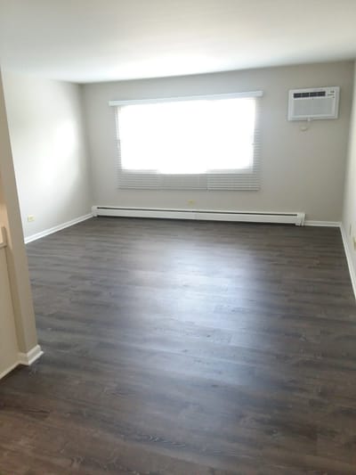 Empty interior of a residential room with window