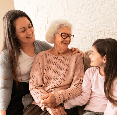 Senior woman with family, smiling and engaging