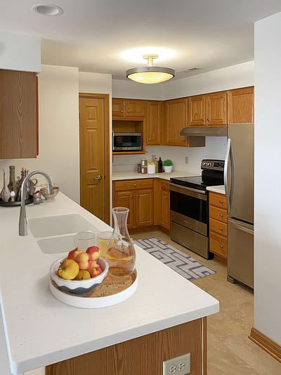 Modern kitchen with fruit and drinks displayed