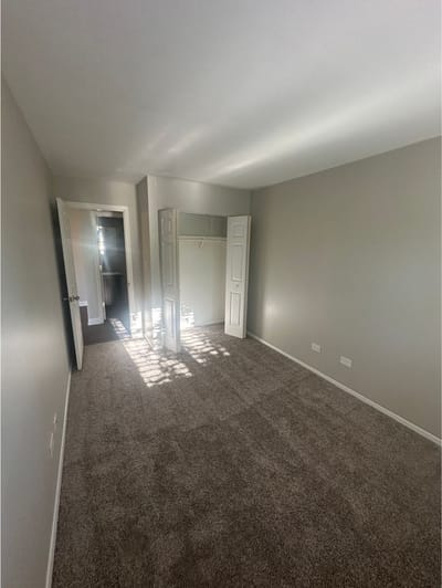 Empty resident room with closet and sunlight