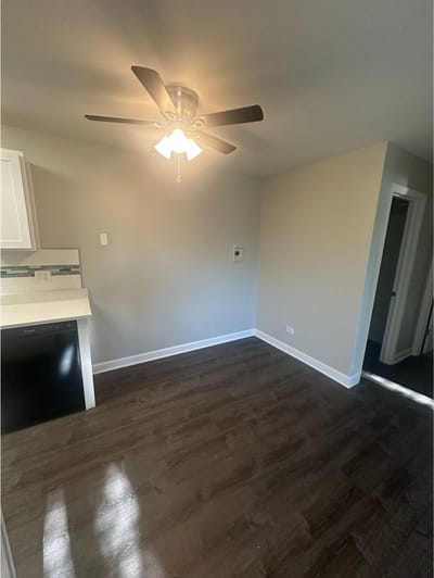 Interior view of a small room with a ceiling fan
