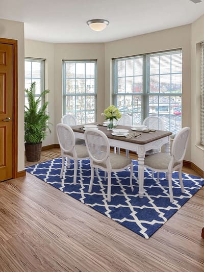 Bright dining area with a table and chairs