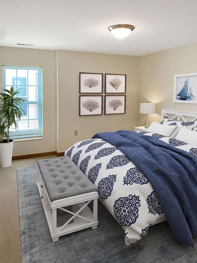Cozy bedroom with modern decor and natural light.