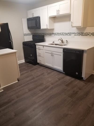 Modern kitchen interior with appliances and cabinets.