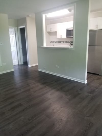 Modern apartment interior with kitchen and living area.