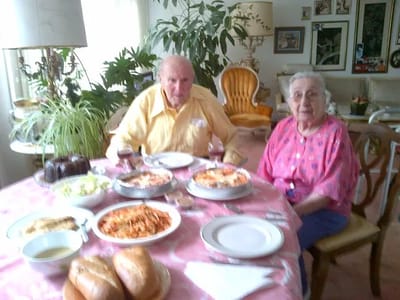 Elderly couple enjoying a meal together.