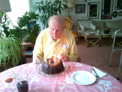 A resident celebrating a birthday with cake