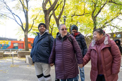 Residents enjoying a walk in a sunny outdoor space