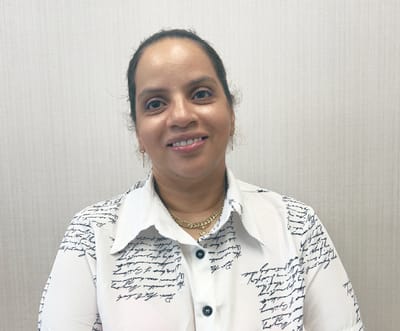 Close-up portrait of a staff member smiling