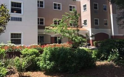 Exterior view of the facility with garden area