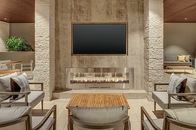 Cozy lounge area with modern seating and fireplace
