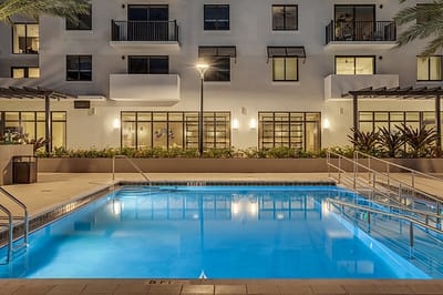 Pool area with landscaping in a senior living facility