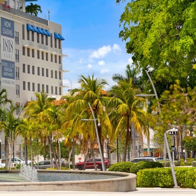 Exterior view of 1818 Park with palm trees