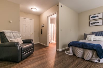 Cozy, well-furnished resident room in a senior living facility