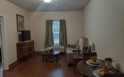 Cozy living room setup in a resident's suite
