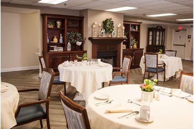 An elegant dining room setup with tables and decor