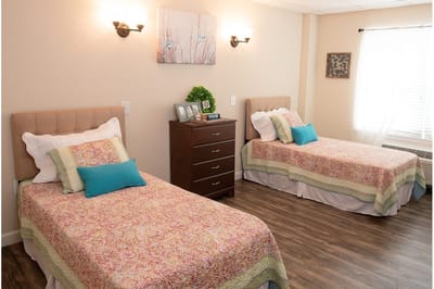 Cozy interior of a shared resident room with two beds