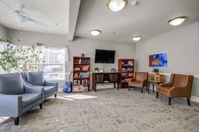 Common area with seating and bookshelves