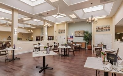 Dining area with tables set for a meal