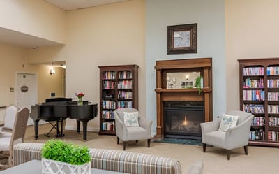 Cozy common area with seating and a piano