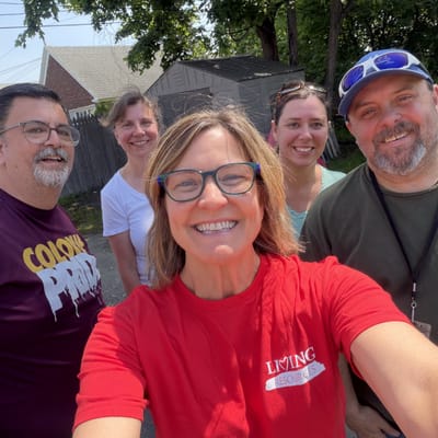 Group photo of staff members outdoors