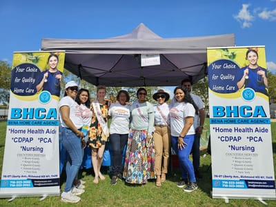 Team members and residents at an outdoor community event