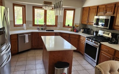 Bright kitchen interior with wooden cabinets and a large island