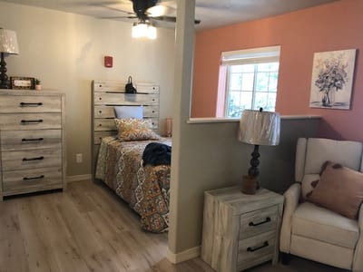 Cozy resident room with bed and seating area