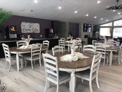 Bright dining area with wooden tables and coffee bar