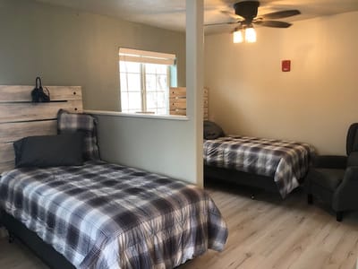 Private resident room with twin beds and natural light