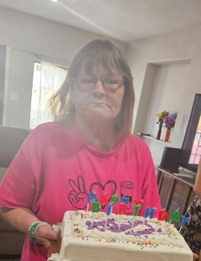 Resident celebrating a birthday with a cake