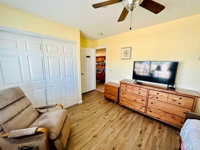 Cozy resident room with furniture and TV