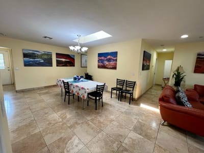 Common area with a dining table and artwork
