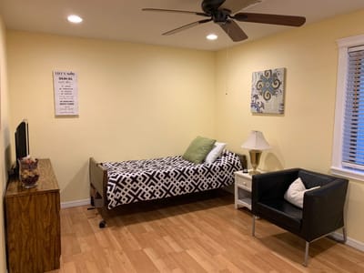 Private resident room with bed and furniture