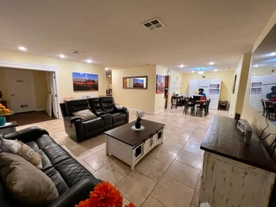 Bright common area with seating and activity tables
