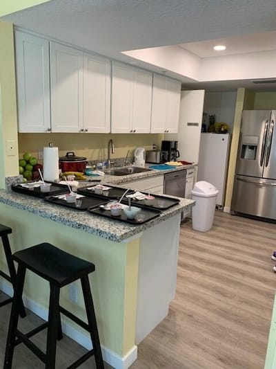 A modern kitchen with dishes and food preparation items