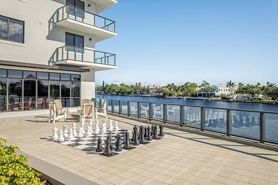 Outdoor chess area by the water at Allegro Fort Lauderdale