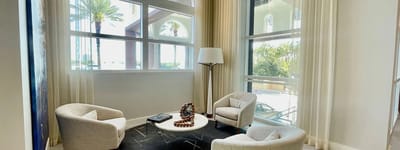Bright common area with seating and large windows