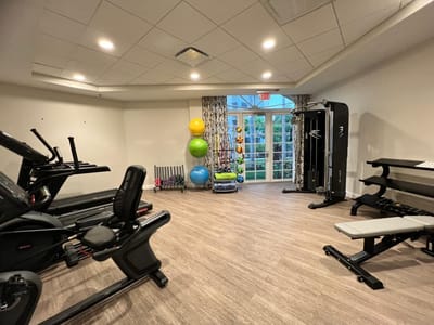 Interior view of a fitness room with exercise equipment