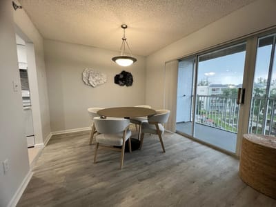 Bright dining area with a view of the outdoor space