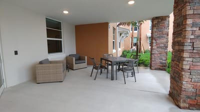 Outdoor seating area with tables and chairs