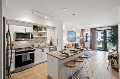 Modern kitchen and living area in a senior living facility
