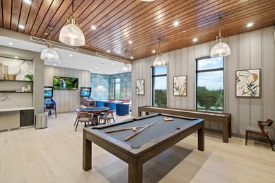 Common area with a pool table and seating
