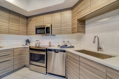 Modern kitchen with wooden cabinetry and appliances
