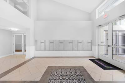 Modern lobby area with mailboxes and decorative floor
