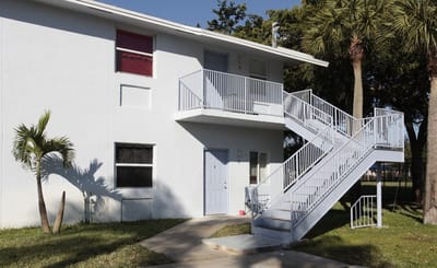 Exterior view of a residential building with stairs